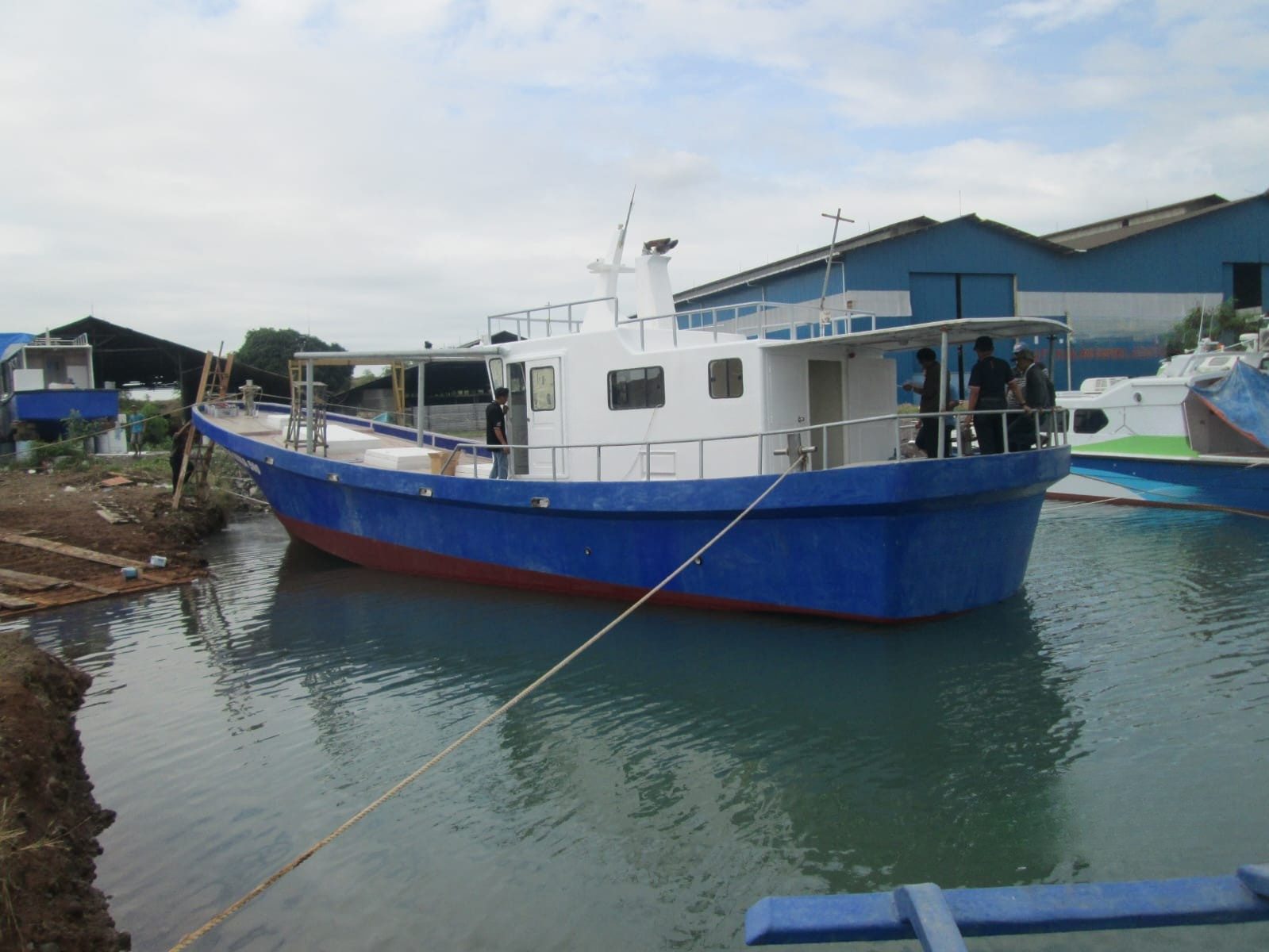 Completed fishing boat alongside